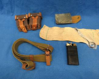 Lot 308. Mosin Nagant cartridge belt, cleaning kit and sling.