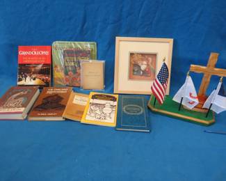 Lot 414. Books including one from 1884, seashell shadowbox, and a handmade Memorial with flags