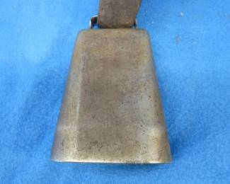 Lot 165. Vintage cowbell and leather strap