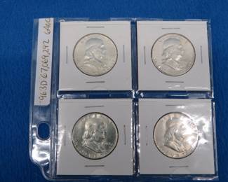Lot 276. Four Franklin Half-dollars