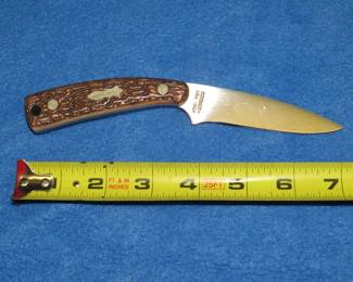 Lot 112. Schrade+ Uncle Henry 154UH fixed blade knife and sheath. Excellent condition.