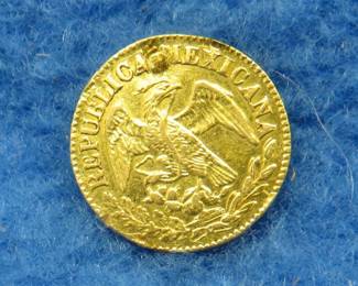 Lot 22. 1860 Mexican gold 1/2 escudo coin. 1.50 grams.