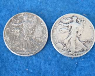 Lot 387. Two Walking Liberty half dollars. 1943 P and one with an obliterated date.