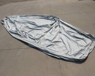 Lot 411. Boat or canoe cover for approx. 15' watercraft. Seller used this to cover canoe in lot #426.