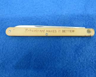 Lot 110. Colonial stainless advertising knife from Schweigert Meats.