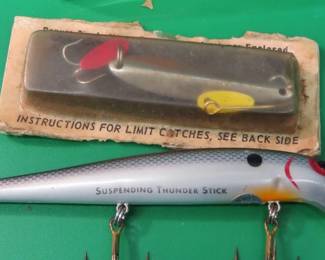 Lot 72. Storm 4 1/2" suspending Thunderstick, Pimple pole, and a 2 1/4" Bomber in a box with paper marked 4MG