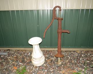 Lot 190. Antique cast iron well pump and a concrete birdbath pedestal