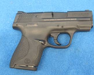 Lot 418. Smith & Wesson M&P Shield. 40 cal. semi-auto pistol. SN JCE9071. Includes two magazines, factory box, and manual.