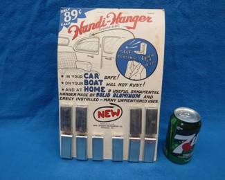 Lot 27. Complete countertop store display of Handi-Hangers. 1940s era.