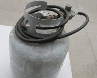 Lot 443. Propane tank, hose, and some fuel