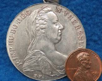 Lot 64. 1780 Austrian silver thaler repurposed as a pendant. 83% silver. 28.54 grams.