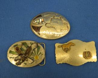Lot 348. Three vintage belt buckles, C&L with inlay but missing one, Lyntone Co. Nickel Silver, and Bucfile Co.