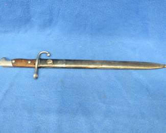 Lot 216. Argentinian Mauser bayonet and sheath with matching serial numbers. Excellent condition.