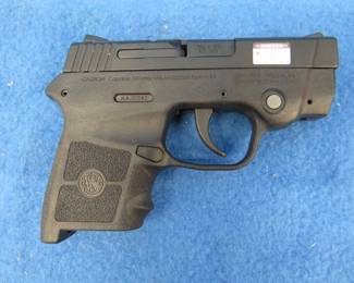 Lot 306. Smith & Wesson Bodyguard semi-auto pistol with laser sight. SN KAJ0342. 380 cal. Includes original box, manual, and a soft case. No magazine.