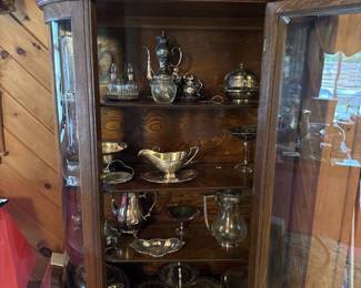 Antique silver cabinet. Dinnerware serving peices