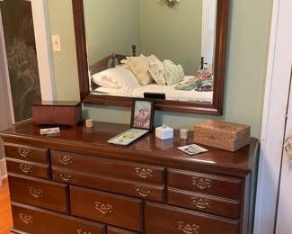 Dresser and mirror that matches the bed and tall dresser