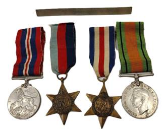 FOUR BRITISH BADGES AND A BAR PIN