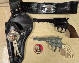 Hopalong Cassidy single holster and Hopalong Cassidy and Topper pinback button.