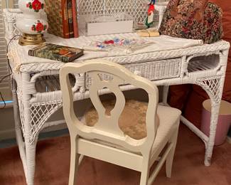 Wicker, writing desk, plush pink area, rug, vintage milk glass lamp