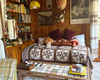 MCM Coffee Table, Mid Century Tension Rod Lamp, Wicker basket swag lamp, bookshelf full of unique books