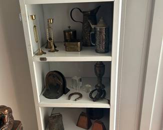 Metal utility cabinet with brass, and metal items