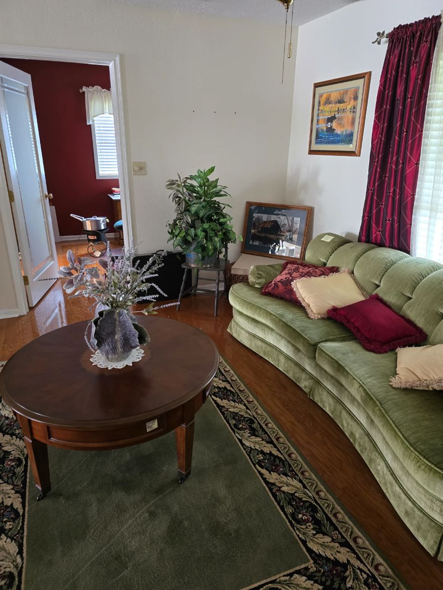 Gorgeous sofa in very good condition.
Round table on wheels.
Artist created pottery pieces