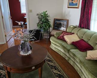 Gorgeous sofa in very good condition.
Round table on wheels.
Artist created pottery pieces