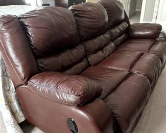Overstuffed full size leather couch. Reclining on left and right side. Non Smoking and pet free home.