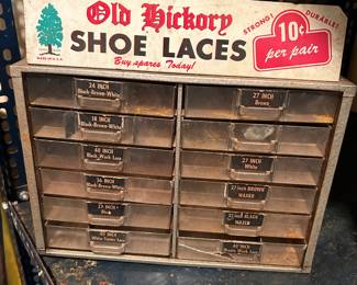 Vintage Hickory metal sign on top shoe laces.