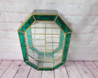 Vintage glass and brass curio display shelf.