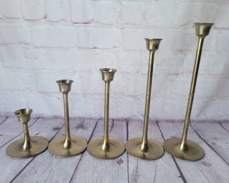 Vintage brass graduated candleholders.