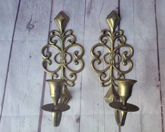Vintage brass wall sconces for candles.