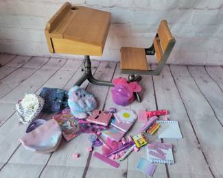 Vintage doll desk and modern doll school accessories.