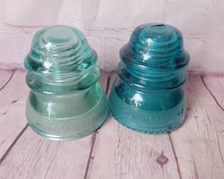 Lot of 2 teal glass insulators.