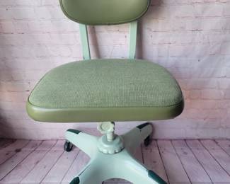 Vintage green industrial chair.