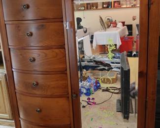 Lovely chest of drawers with a mirror and shelves behind it.