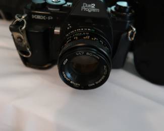 Sears film SLR with extra lens and flash.