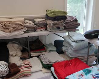 Linen, placements, blankets, and sheet sets abound.