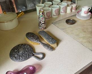 Glass sock farmer and sterling dresser pieces