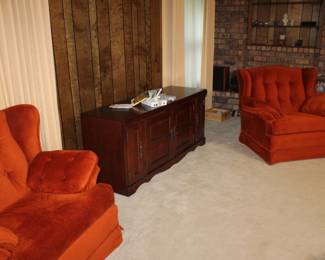 pair burnt orange easy chairs