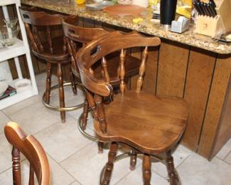 three swiveling bar stools