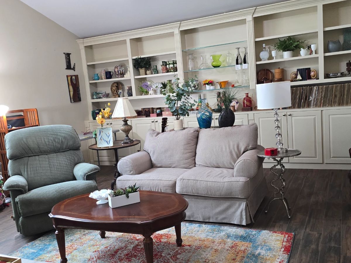 Something for everyone! Sofa, recliner, several coffee tables, glass decor, etc