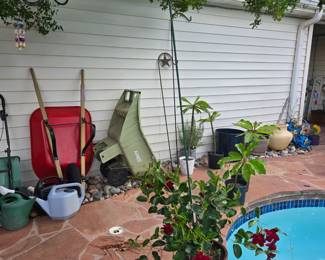 wheel barrow, garden cart, watering cans, etc
