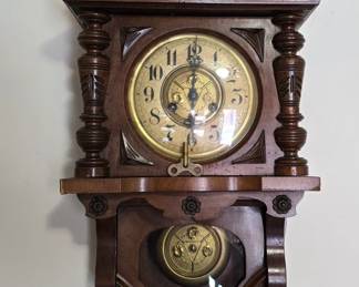 Antique wall clock with key