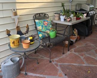BBQ, outdoor table and chair, variety of plants in decorative pots