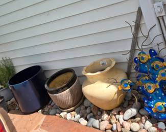 selection of planters, pots, plants and supplies