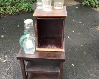 Small table. 19” x 15” x 21” h. Small wood cabinet 12” x 10” x 16”. Antique bottles