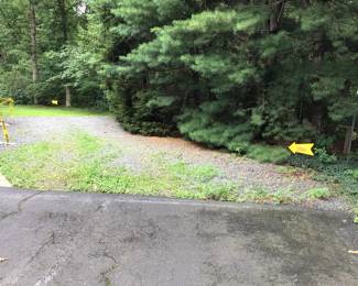 Follow the signs, you will pass the yellow shed and then come to the parking area. Thanks