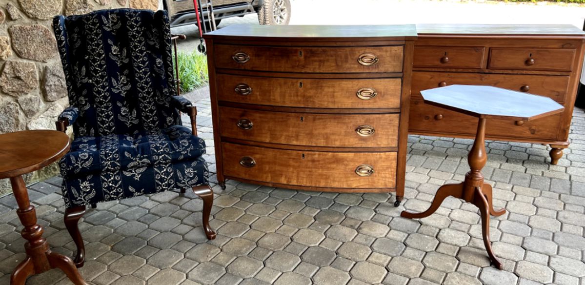 Antique Chests, candle stands and traditional style chair.