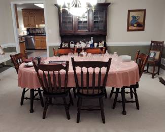 Dining table, six chairs and china cabinet. Table has custom protection pads for surface.